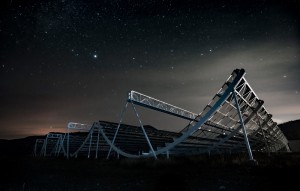 The halfpipe-like CHIME telescope rendered under a dark, atmospheric sky in Penticton, B.C.